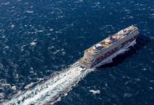 The new LNG-fueled cruise ship Mein Schiff Flow sails on the open sea.