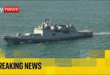 A Russian frigate warship sails on the sea amidst maritime security concerns.