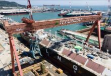 A sleek, modern hybrid-electric LNG carrier vessel design on the ocean.
