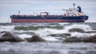 The vessel Kiwala sails on the open sea, symbolizing global shipping and illicit fleets.