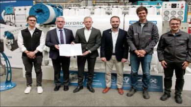 Officials inspect the newly certified BeHydro 100% hydrogen marine engine.