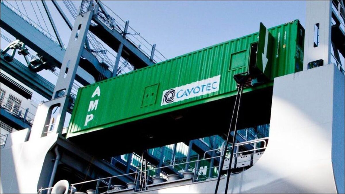 Cavotec shore power system connected to a container ship at a modern port.