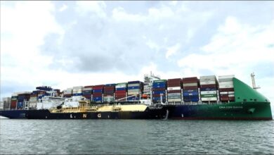 A FueLNG vessel conducts a ship-to-ship LNG bunkering operation in Singapore.