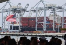 Gene Seroka, Executive Director of the Port of Los Angeles, speaks at a podium.