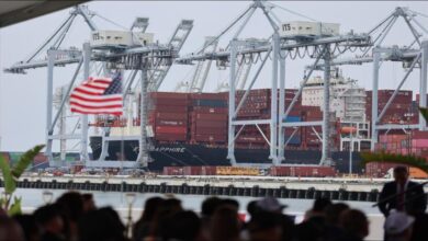 Gene Seroka, Executive Director of the Port of Los Angeles, speaks at a podium.