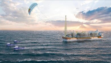 A large SeaKite sail pulls an FPSO vessel for wind-assisted towing offshore.