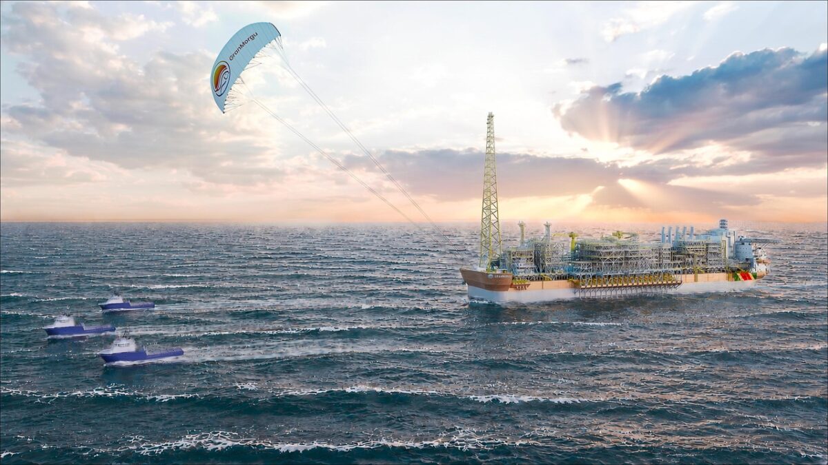 A large SeaKite sail pulls an FPSO vessel for wind-assisted towing offshore.