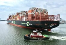 Tugboat assists a large ZIM LNG-fueled container ship in a Virginia port.