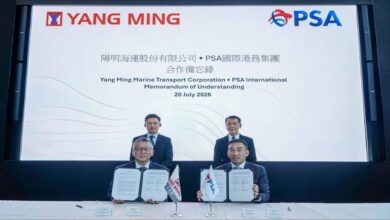 Yang Ming and PSA executives commemorate their partnership for sustainable global supply chain decarbonization.