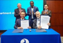 Officials from MARAD and Port of Long Beach sign a nuclear shipping agreement.