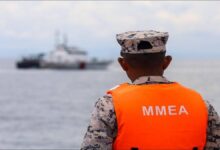 Malaysian Maritime Enforcement Agency vessel on patrol related to unauthorized anchoring.