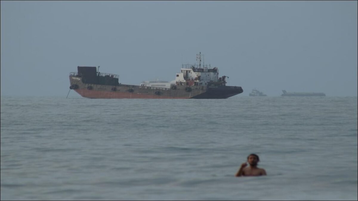Oil tankers navigate the strategic Strait of Hormuz, crucial for global energy transport.