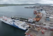 A NorthLink ferry docked at Lerwick Harbour for shore power connection.