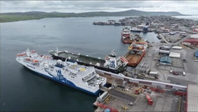 A NorthLink ferry docked at Lerwick Harbour for shore power connection.