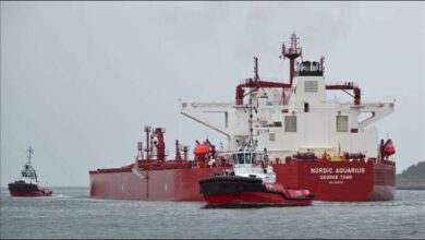 A large oil tanker vessel on the water, representing a firm's exit from the Strait of Hormuz.
