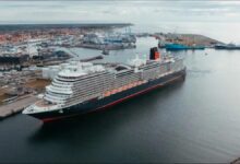 A large cruise ship docked at Skagen port, symbolizing future shore power integration.