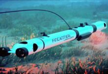 Sleek, futuristic underwater vehicle navigating dark ocean depths, symbolizing marine tech leadership.