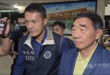Chang Kuo-hua, Evergreen Marine director, smiling and wearing a suit.