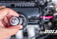 A new automotive engine coolant thermostat featuring a visible spring mechanism.