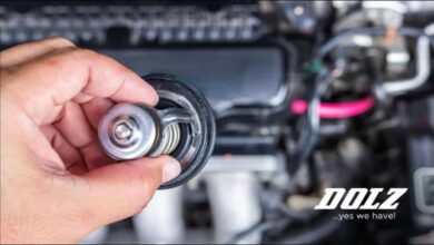 A new automotive engine coolant thermostat featuring a visible spring mechanism.