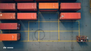 A large container ship packed with cargo containers sails, illustrating global supply chain logistics.