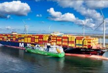 An MSC container ship being refuelled by a smaller vessel at a busy port.