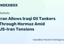 An oil tanker navigates calm waters, vital for Strait of Hormuz transit.