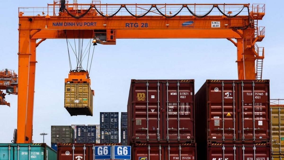 A Maersk container ship sails on the ocean, representing global freight logistics.
