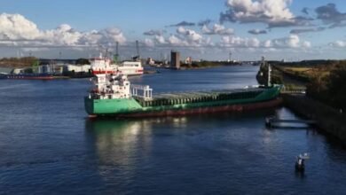 Irish cargo ship Arklow Falcon aground against a Dutch canal embankment.
