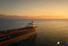A massive oil tanker sails through open waters, symbolizing crude oil transport.