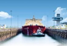 A large vessel transits the Panama Canal locks, central to global shipping routes.