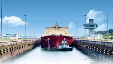 A large vessel transits the Panama Canal locks, central to global shipping routes.