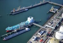 Modern port with container ships and green fuel bunkering infrastructure.