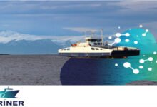Illustration of a ship with green energy symbols for the MARINER project's decarbonization efforts.