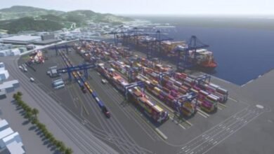 A render of La Spezia Container Terminal with large cranes and a container ship.