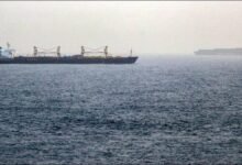 A large cargo ship navigates a crucial Middle East shipping route.