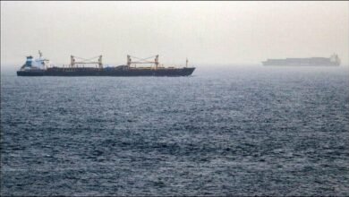 A large cargo ship navigates a crucial Middle East shipping route.