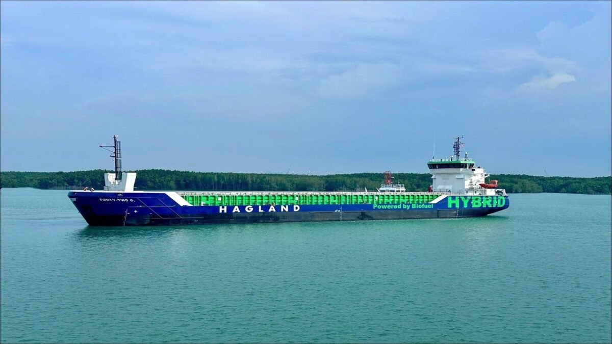 Wind-assisted combi freighter sailing on the open sea.