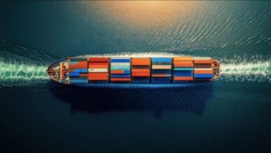 A large container ship navigating ocean waters, representing global maritime decarbonization efforts.