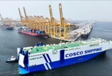 COSCO-managed car carrier Min Jiang Kou sailing on calm seas.