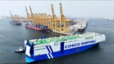 COSCO-managed car carrier Min Jiang Kou sailing on calm seas.
