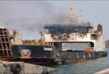 A large commercial cargo ship sails on the Red Sea.