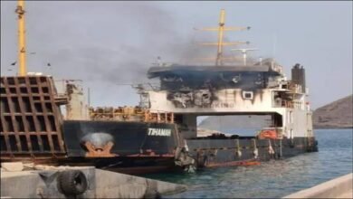 A large commercial cargo ship sails on the Red Sea.
