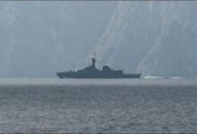 A large container ship navigates a vital shipping lane in the Red Sea.