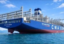 A large CMA CGM methanol-powered containership sails at sea.
