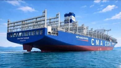 A large CMA CGM methanol-powered containership sails at sea.