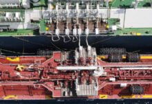 An LNG bunkering vessel, the Avenir Advantage, sails on calm waters.