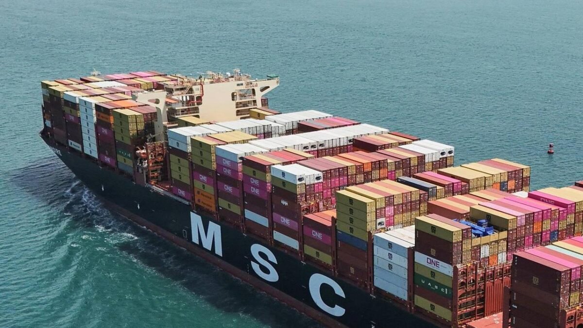 A large MSC cruise ship with its logo visible on the funnel sails on the ocean.