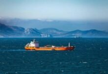 Large cargo ship sailing at sea, representing maritime industry FuelEU compliance.