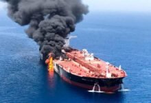 A large crude oil tanker sails through the Strait of Hormuz.